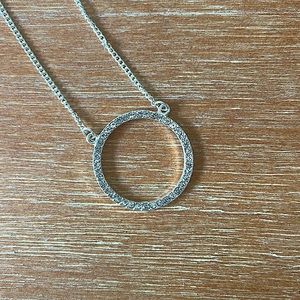 silver necklace with sparkly ring